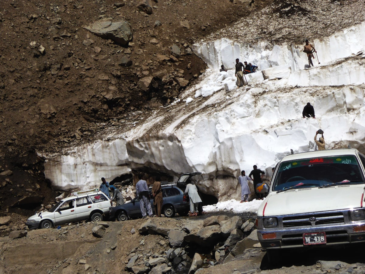 Men collecting ice at Lowari Pass.